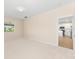 Neutral bedroom with a large window and an open doorway to the ensuite bathroom at 1717 Bonita Bluff Ct, Ruskin, FL 33570