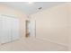 Bedroom with a double closet and a doorway leading to another room at 1717 Bonita Bluff Ct, Ruskin, FL 33570