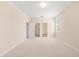 Spacious bedroom featuring neutral carpeting, light walls, and ample natural light from a window at 1717 Bonita Bluff Ct, Ruskin, FL 33570