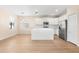 Open kitchen featuring white cabinetry, stainless steel appliances, and a textured island at 1717 Bonita Bluff Ct, Ruskin, FL 33570