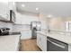 Well-appointed kitchen featuring white cabinets, granite countertops, and stainless appliances at 1717 Bonita Bluff Ct, Ruskin, FL 33570