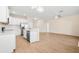 Modern kitchen with stainless steel appliances, island with sink, and open floor plan at 1717 Bonita Bluff Ct, Ruskin, FL 33570