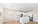 Bright eat-in kitchen boasts white cabinets, stainless appliances, and a sleek island at 1717 Bonita Bluff Ct, Ruskin, FL 33570