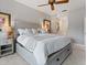 This bedroom features a large bed with storage, bedside tables and elegant decor at 1720 Kestral Park S Way # 49, Sarasota, FL 34231