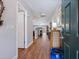 Inviting foyer with hardwood floors, fresh paint, and an open view of the living spaces at 1720 Kestral Park S Way # 49, Sarasota, FL 34231