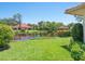 Scenic view of a pond surrounded by lush greenery and manicured lawns at 1720 Kestral Park S Way # 49, Sarasota, FL 34231