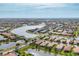 Aerial view of community showcasing lakefront properties and community amenities at 19138 Kirella St, Venice, FL 34293