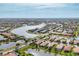 Aerial view of community showcasing lakefront properties and community amenities at 19138 Kirella St, Venice, FL 34293