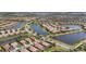 Aerial view of the community featuring picturesque lakes and well-maintained homes at 19138 Kirella St, Venice, FL 34293