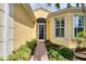 Close-up view of the front entrance showcasing the walkway and well-maintained landscaping at 19138 Kirella St, Venice, FL 34293