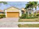 Charming single-Gathering home featuring a well-manicured lawn and a two-car garage at 19138 Kirella St, Venice, FL 34293