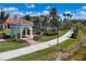 Picturesque gazebo in a well-maintained park setting with lush landscaping, palm trees, and a scenic walking path at 19138 Kirella St, Venice, FL 34293