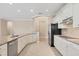 Kitchen featuring stainless steel appliances, granite countertops, and bright cabinetry at 19138 Kirella St, Venice, FL 34293