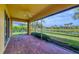 Relaxing screened-in lanai with serene views of the lake and green space, perfect for outdoor living at 19138 Kirella St, Venice, FL 34293