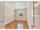 Bright office space featuring wood floors, white trim and a ceiling fan at 19138 Kirella St, Venice, FL 34293