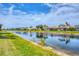 Beautiful water view showcasing the community's tranquil lake and well-maintained landscaping at 19138 Kirella St, Venice, FL 34293