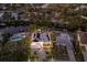 Aerial view of the neighborhood showing the home, solar panels, landscaping, and canal at 238 Island Cir, Sarasota, FL 34242
