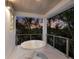 Balcony with white railings, a round table, and views of the surrounding landscape at 238 Island Cir, Sarasota, FL 34242