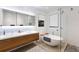 Luxurious bathroom with a freestanding tub, double vanity, and a modern shower area at 238 Island Cir, Sarasota, FL 34242