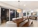 Elegant dining area with wooden table, cozy chairs, and large windows providing ample natural light at 238 Island Cir, Sarasota, FL 34242