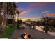 Relaxing waterfront dock with lounge chairs, fire pit, and boat parking at 238 Island Cir, Sarasota, FL 34242