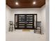 Stylish front door with sleek design, flanked by decorative chairs, offering a welcoming entrance to the home at 238 Island Cir, Sarasota, FL 34242