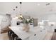 Bright kitchen boasts a large center island, pendant lighting, and stainless steel appliances at 238 Island Cir, Sarasota, FL 34242
