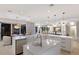 Spacious open concept kitchen features double sinks, modern appliances, and pendant lighting above the island at 238 Island Cir, Sarasota, FL 34242