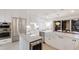 Modern kitchen featuring stainless steel appliances, a wine cooler, and a large island with a farm sink at 238 Island Cir, Sarasota, FL 34242
