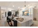 Spacious living room with built-in media center, a large sectional, and plenty of natural light at 238 Island Cir, Sarasota, FL 34242