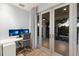 Well-lit office space with balcony access, modern desk setup, and serene outdoor views at 238 Island Cir, Sarasota, FL 34242