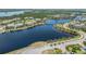 Wide aerial shot featuring a bridge over a body of water, connecting a beautiful, luxurious waterfront community at 241 Sapphire Lake Dr # 201, Bradenton, FL 34209