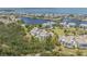 Aerial view showcasing a lakeside community with beautiful homes, lush landscaping, and stunning water views at 241 Sapphire Lake Dr # 201, Bradenton, FL 34209