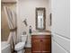 Charming bathroom with decorative mirror, granite countertop and decorative beach accents at 241 Sapphire Lake Dr # 201, Bradenton, FL 34209