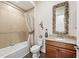 Charming bathroom with decorative mirror, granite countertop and decorative beach accents at 241 Sapphire Lake Dr # 201, Bradenton, FL 34209