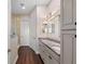 Bright bathroom featuring a dual sink vanity with granite countertop and a glass enclosed shower at 241 Sapphire Lake Dr # 201, Bradenton, FL 34209