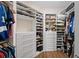 Spacious walk-in closet with custom shelving and ample storage space for clothes, shoes, and accessories at 241 Sapphire Lake Dr # 201, Bradenton, FL 34209