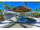 Inviting outdoor common space with a thatched umbrella and seating for gatherings at 241 Sapphire Lake Dr # 201, Bradenton, FL 34209
