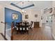 Spacious dining room showcases a chandelier and stylish wood floors at 241 Sapphire Lake Dr # 201, Bradenton, FL 34209