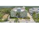 Charming two-story exterior showcasing the welcoming front porches and lush landscaping at 241 Sapphire Lake Dr # 201, Bradenton, FL 34209