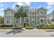 Inviting townhouse with a charming front porch, well-maintained landscaping, and a welcoming entrance at 241 Sapphire Lake Dr # 201, Bradenton, FL 34209