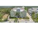 Charming townhouse with a covered entry, a tower feature, manicured landscaping, and scenic views at 241 Sapphire Lake Dr # 201, Bradenton, FL 34209