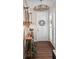 Welcoming foyer with wood flooring, a charming chandelier, and coastal-inspired decor at 241 Sapphire Lake Dr # 201, Bradenton, FL 34209