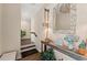 Inviting foyer with wood floors, decorative mirror, and a console table adorned with coastal accents at 241 Sapphire Lake Dr # 201, Bradenton, FL 34209