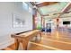 Enjoy the game room with shuffleboard, tall ceilings, comfortable seating and nautical themed decorations throughout the room at 241 Sapphire Lake Dr # 201, Bradenton, FL 34209