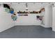 Spacious two car garage with shelving and overhead storage at 241 Sapphire Lake Dr # 201, Bradenton, FL 34209