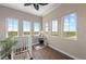 Hallway features hardwood floors, three windows with beautiful views and neutral paint at 241 Sapphire Lake Dr # 201, Bradenton, FL 34209
