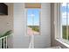 Hallway features shiplap walls and window with lovely views at 241 Sapphire Lake Dr # 201, Bradenton, FL 34209