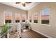 Hallway features hardwood floors, three windows with a beautiful sunset view and neutral paint at 241 Sapphire Lake Dr # 201, Bradenton, FL 34209