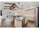 Modern kitchen features granite counters and island seating at 241 Sapphire Lake Dr # 201, Bradenton, FL 34209